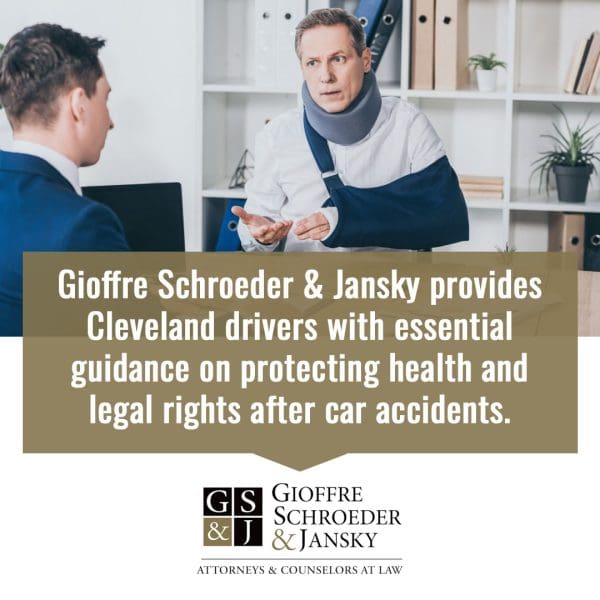 Injured man wearing a neck brace and arm sling consulting with an attorney about legal rights after a car accident.