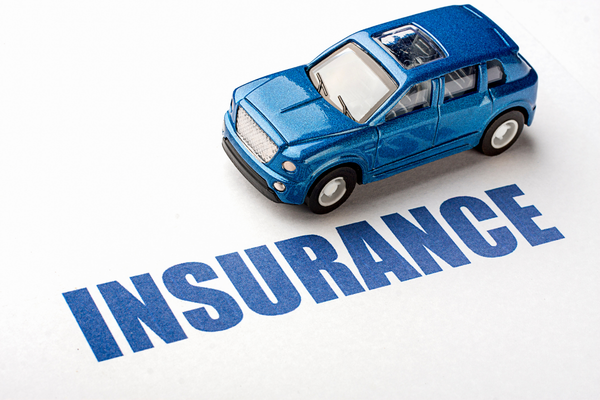 Blue toy car over words: Insurance.